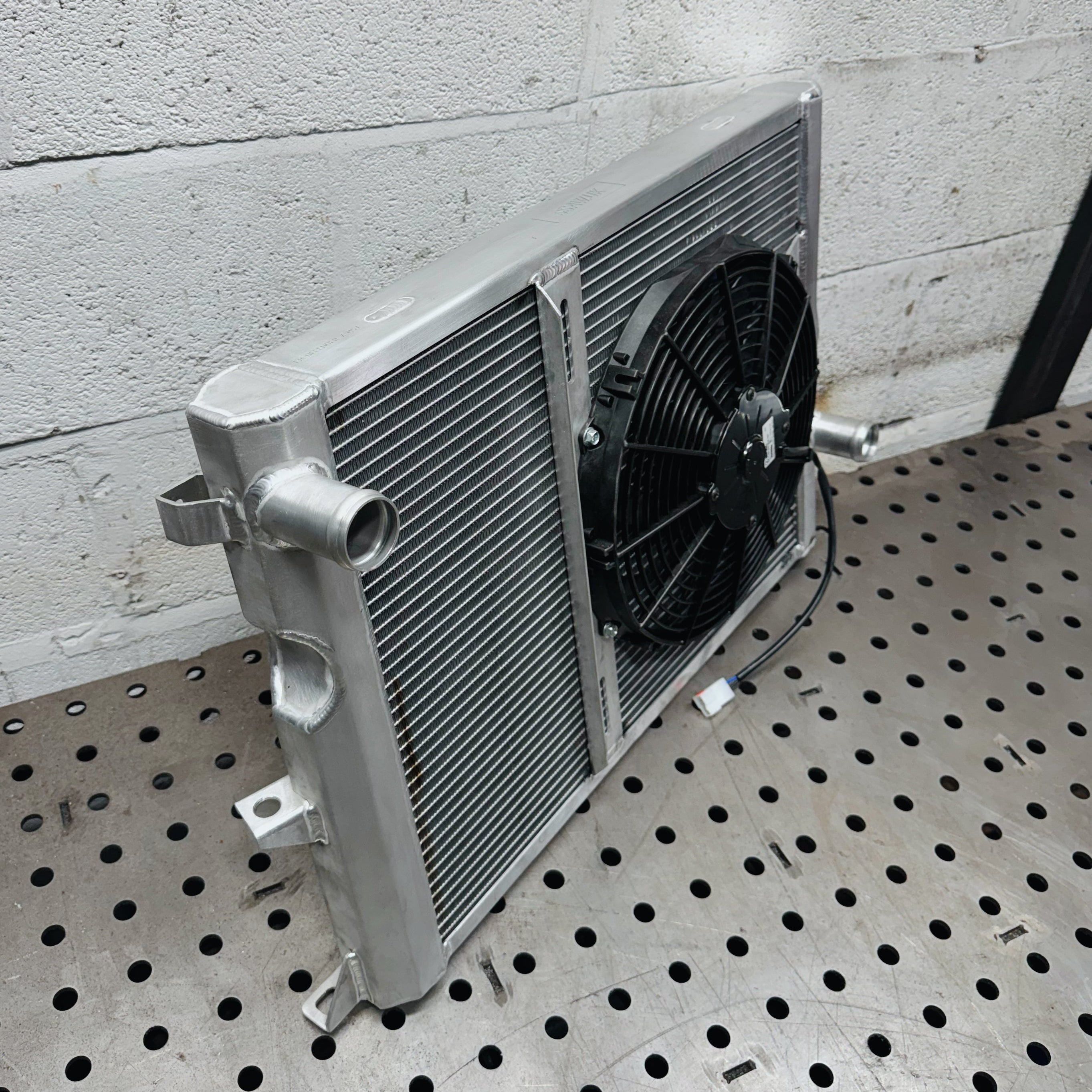 LAND ROVER DEFENDER PUMA ALUMINIUM RADIATOR W/ FAN MOUNT